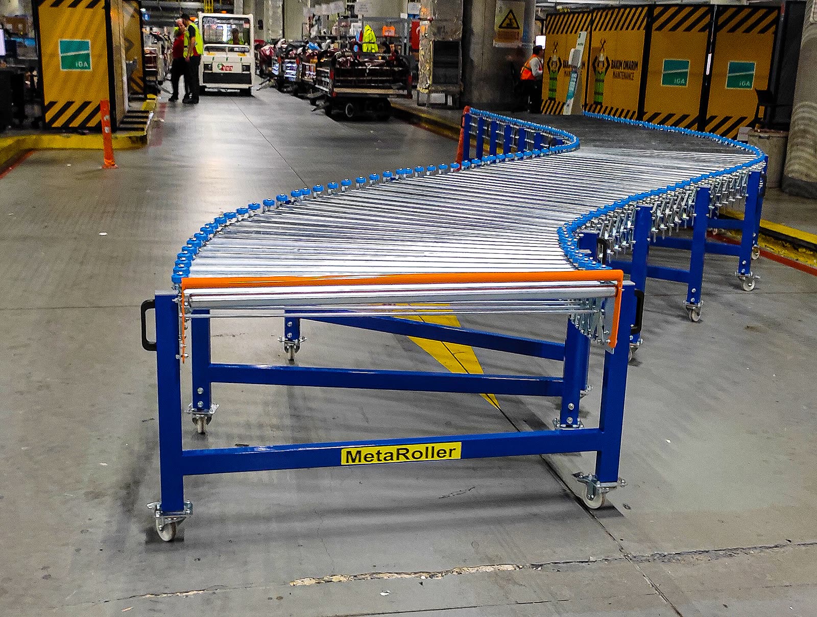 A roller conveyor on a warehouse floor