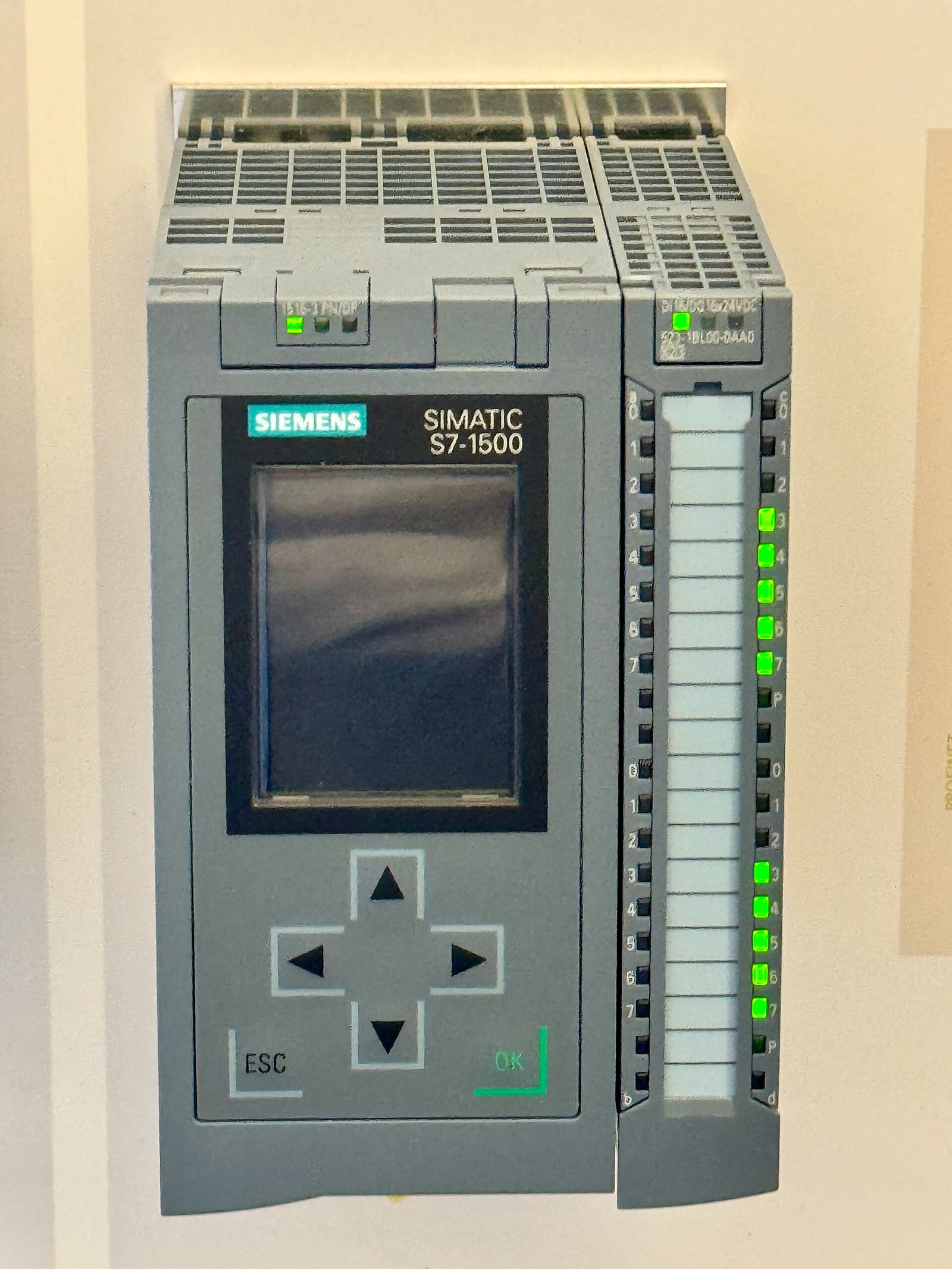 A Siemens S7-1500 PLC with its status LEDs lit